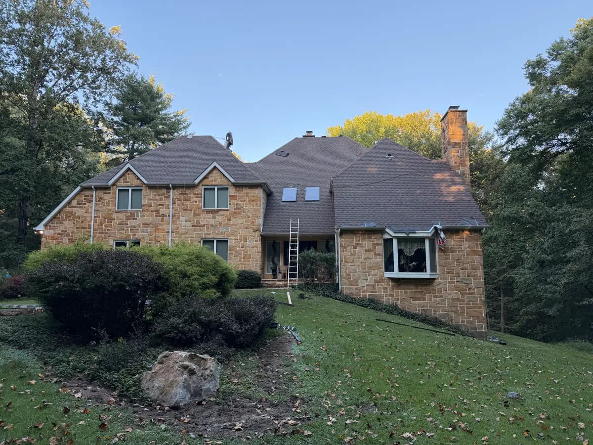 Exterior view of a McLean home with a finished asphalt shingle roof